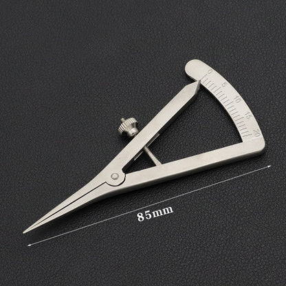 Adjustable wing divider with 85 mm range marking and mm scale on dark surface