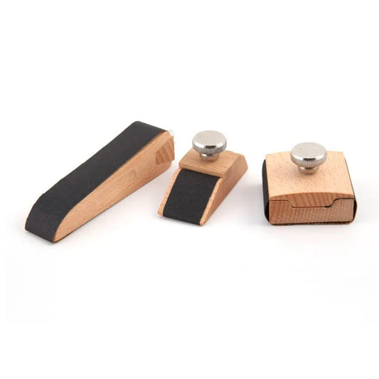 Leather sanding block with wooden base and round metal knob, trapezoid and square shapes