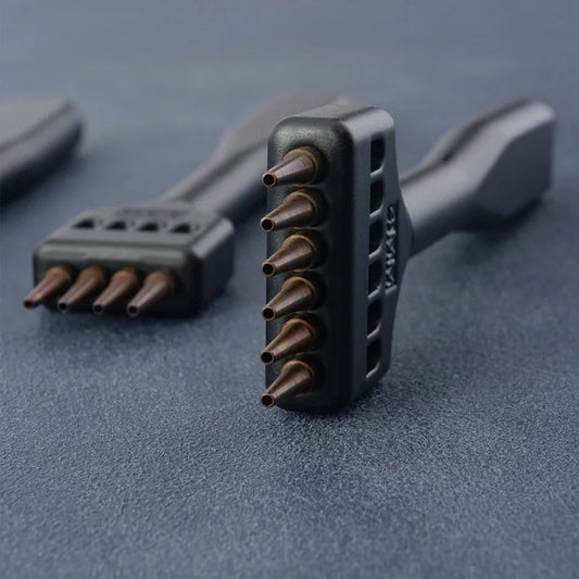 Black round hole punch tool with multiple copper-prong holes for leather