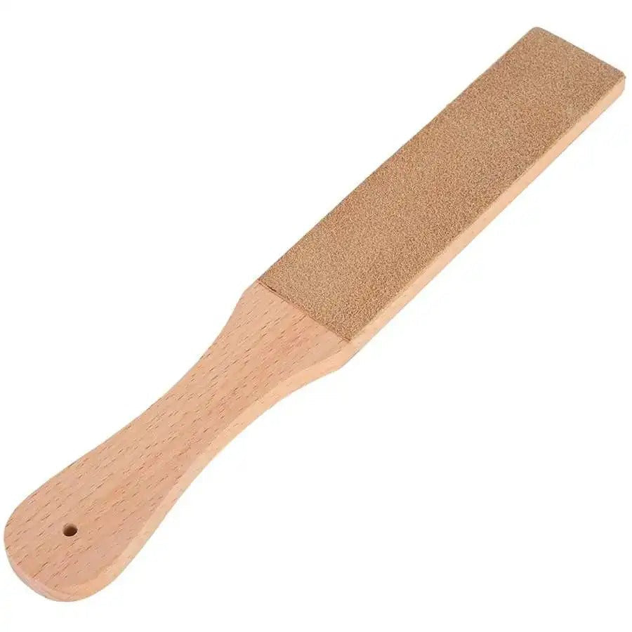 Leather sharpening strop with tan handle and brown abrasive pad