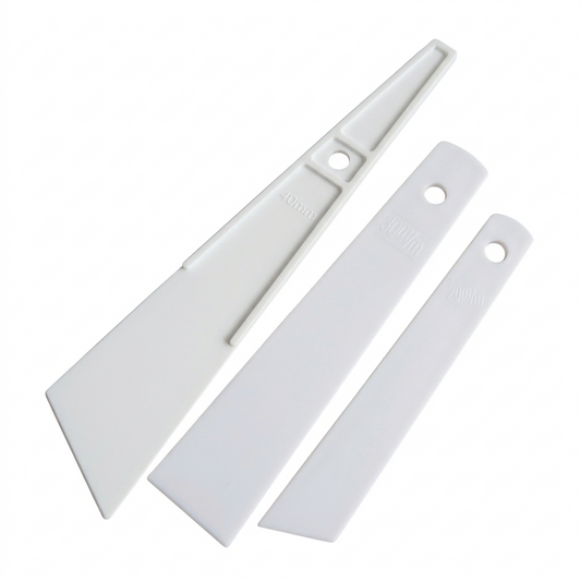 White plastic glue applicators, three pieces with ml markings and hanging holes