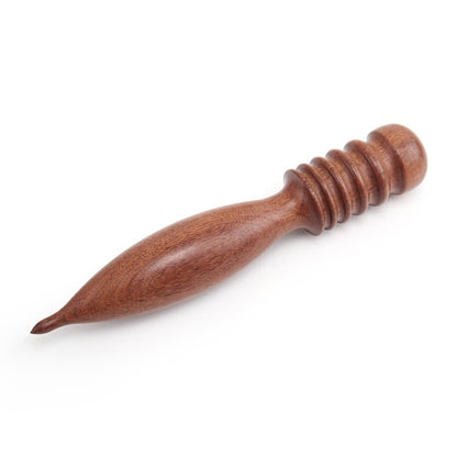 Wooden tool with a textured handle on a white background