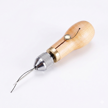 Leather hand stitching awl with light wood handle, silver head, and thread needles