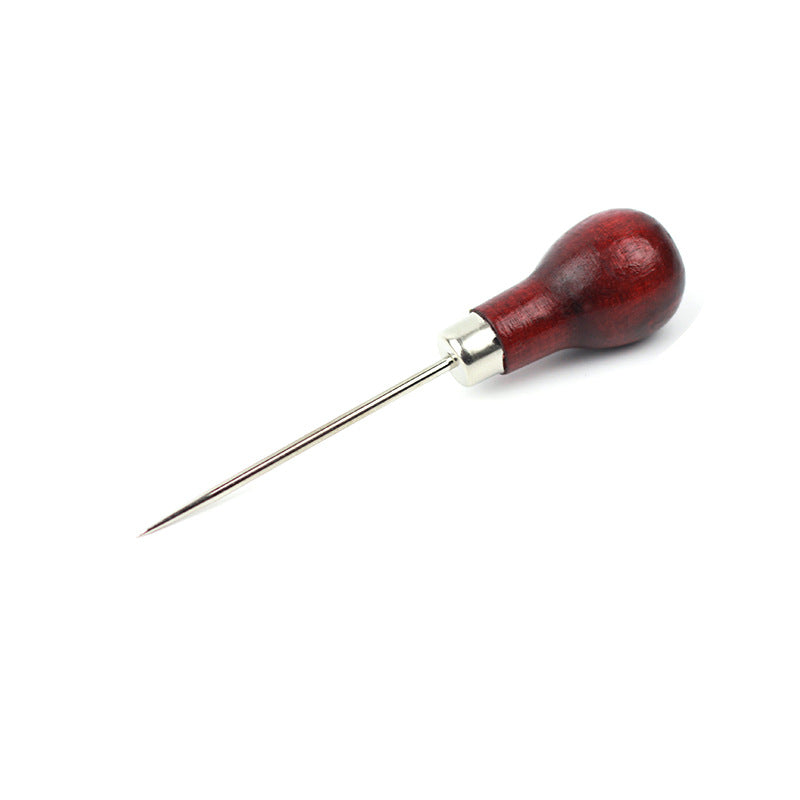 Wooden-handled sewing needle on a white background