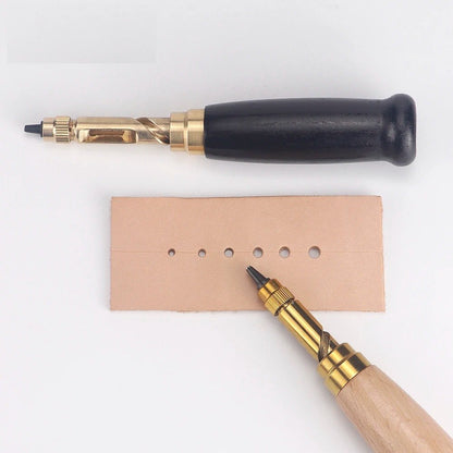 Black-handled rotary leather punch tool with leather strip and several punched holes