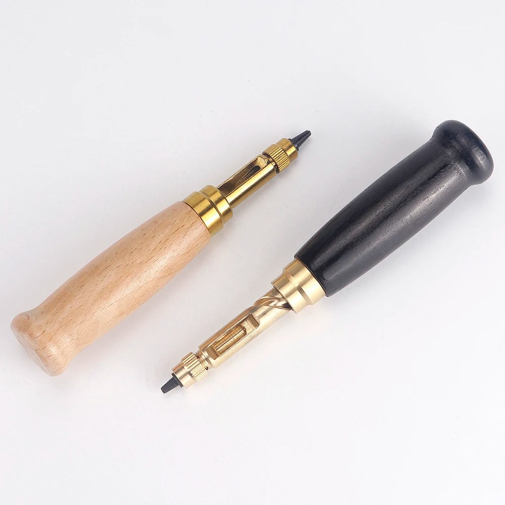 Rotary leather punch tool with wooden and black handles and gold metal punch mechanism