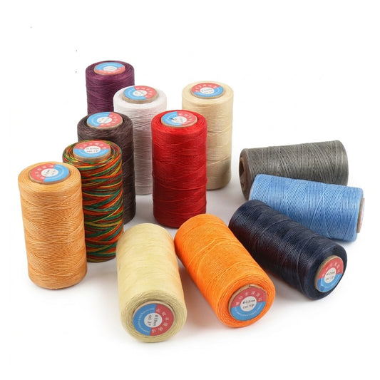 Assorted waxed polyester sewing thread spools, multiple colors shown